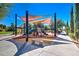 The community playground with a sunshade offers a safe and fun environment for children at 119 E Camellia Way, San Tan Valley, AZ 85140