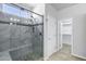 The bathroom features a glass enclosed shower with seating and mosaic details at 119 E Camellia Way, San Tan Valley, AZ 85140