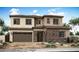 Charming two-story home with a stone facade and well-manicured desert landscaping at 1343 E Plum St, Gilbert, AZ 85298