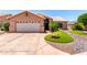 Charming single-story home with a well-manicured yard and a two-car garage at 15073 W Piccadilly Rd, Goodyear, AZ 85395