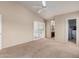View of the main bedroom showcasing the plantation shutters, ensuite access, and a walk-in closet at 15073 W Piccadilly Rd, Goodyear, AZ 85395