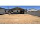 Exterior shows the backyard and back of the home in construction at 15789 W Beryl Ave, Waddell, AZ 85355