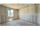 Unfinished bedroom shows drywall and a window at 15789 W Beryl Ave, Waddell, AZ 85355