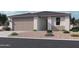 Charming single-story home with a two-car garage and well-maintained landscaping at 15789 W Beryl Ave, Waddell, AZ 85355