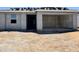 Unfinished home exterior shows front entrance and two-car garage at 15789 W Beryl Ave, Waddell, AZ 85355