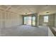 Unfinished living room with sliding glass doors at 15789 W Beryl Ave, Waddell, AZ 85355