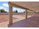 Spacious covered patio and low-maintenance gravel backyard perfect for outdoor entertaining at 1623 E Maplewood Ave, Buckeye, AZ 85326