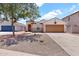 Inviting single-Gathering home with a two-car garage and well-maintained front yard at 1623 E Maplewood Ave, Buckeye, AZ 85326