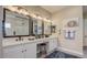 Bathroom with double vanity, granite countertop, and a makeup station at 16342 W Jackson St, Goodyear, AZ 85338