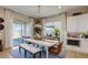 Bright dining room with modern lighting and a sliding glass door to the patio at 16342 W Jackson St, Goodyear, AZ 85338