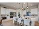 Modern kitchen with stainless steel appliances, a center island, and a tiled backsplash at 16342 W Jackson St, Goodyear, AZ 85338