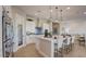 Bright open kitchen featuring a center island with bar seating and pantry at 16342 W Jackson St, Goodyear, AZ 85338