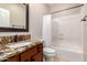 Bathroom featuring granite vanity, shower-tub combo, and neutral walls at 1688 W Corriente Dr, San Tan Valley, AZ 85144