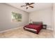 Cozy bedroom with tile flooring, natural light, and ample closet space at 1688 W Corriente Dr, San Tan Valley, AZ 85144