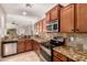Well-equipped kitchen with stainless steel appliances and granite countertops at 1688 W Corriente Dr, San Tan Valley, AZ 85144
