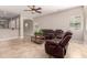 Spacious living room with tile flooring, ceiling fan, and comfortable seating at 1688 W Corriente Dr, San Tan Valley, AZ 85144