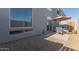 Home's exterior with large window and a patio with gravel landscaping at 1851 W Vermont Ave, Phoenix, AZ 85015
