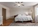 Cozy bedroom featuring laminate wood floors, neutral walls, and a ceiling fan for added comfort at 1851 W Vermont Ave, Phoenix, AZ 85015