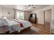 Bright bedroom features a ceiling fan, wood floors, and a cozy rug at 1851 W Vermont Ave, Phoenix, AZ 85015