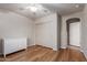 Bright bedroom features a dresser, closet, ceiling fan, and wood floors at 1851 W Vermont Ave, Phoenix, AZ 85015