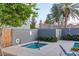 Cozy hot tub area with surrounding wall and nearby palm trees at 1851 W Vermont Ave, Phoenix, AZ 85015