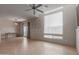 Spacious open-plan living room featuring tile flooring, neutral paint, and abundant natural light at 1851 W Vermont Ave, Phoenix, AZ 85015