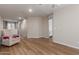 Upstairs loft showcasing laminate floors, a cozy chair, ample closet space, and neutral paint at 1851 W Vermont Ave, Phoenix, AZ 85015