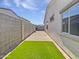 Private backyard with artificial turf and walkway at 1953 W Stage Driver St, Apache Junction, AZ 85120