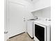 Well-lit laundry room with modern washer and dryer at 1953 W Stage Driver St, Apache Junction, AZ 85120