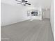 Spacious living room with plush carpeting, ceiling fan, and ample natural light at 1953 W Stage Driver St, Apache Junction, AZ 85120