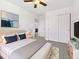 Comfortable main bedroom with soft carpet, ceiling fan, ensuite bathroom, and ample closet space at 1953 W Stage Driver St, Apache Junction, AZ 85120