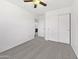 This spacious main bedroom offers ceiling fan, neutral carpet, ensuite bathroom and large closet at 1953 W Stage Driver St, Apache Junction, AZ 85120