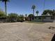 Expansive backyard with mature palm trees, updated landscaping, and potential for outdoor living at 2325 E Osborn Rd, Phoenix, AZ 85016