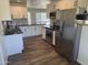 Modern kitchen with stainless steel appliances, white cabinetry, and a stylish backsplash at 2325 E Osborn Rd, Phoenix, AZ 85016