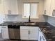 Beautiful kitchen featuring stainless steel appliances, granite countertops, and ample cabinet space at 2325 E Osborn Rd, Phoenix, AZ 85016
