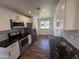 Bright kitchen featuring stainless steel appliances, granite countertops, and ample counter space at 2325 E Osborn Rd, Phoenix, AZ 85016