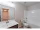 Bathroom featuring white fixtures and shower-tub combo at 23852 W La Salle St, Buckeye, AZ 85326