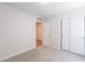 Empty bedroom with plush carpet and view to hallway at 23852 W La Salle St, Buckeye, AZ 85326
