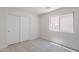 Bedroom with plush carpet and sliding door closet at 23852 W La Salle St, Buckeye, AZ 85326
