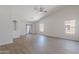 Bright living room with sliding glass doors to backyard, and large windows for natural light at 23852 W La Salle St, Buckeye, AZ 85326