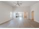 A bright and spacious living room features high ceilings and an open floor plan that leads to the kitchen at 23852 W La Salle St, Buckeye, AZ 85326