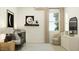 Cozy Bedroom with a crib, accent wall, and modern furniture, creating a warm ambiance at 25169 N 177Th Dr, Surprise, AZ 85387