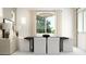 A bright dining room features modern furnishings and a minimalist design at 25169 N 177Th Dr, Surprise, AZ 85387