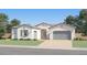 A charming single-story home displays a well-manicured lawn and stylish exterior at 25169 N 177Th Dr, Surprise, AZ 85387