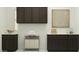 This laundry room features dark cabinets, white countertops, and stylish decor, creating an efficient and aesthetically pleasing space at 25169 N 177Th Dr, Surprise, AZ 85387