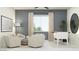 Bright living room with comfortable seating, modern decor, and a foosball table at 25169 N 177Th Dr, Surprise, AZ 85387