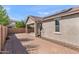 Paver patio and backyard featuring a block wall and solar panels at 3326 N 31St St, Mesa, AZ 85213