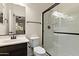 Well-lit bathroom with a glass-enclosed shower, dark accents, and modern fixtures for a clean aesthetic at 3326 N 31St St, Mesa, AZ 85213
