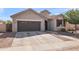 Charming single-story home featuring a two-car garage and landscaped front yard, showcasing modern design at 3326 N 31St St, Mesa, AZ 85213