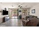 Comfortable living room with wood flooring, entertainment center, and natural light at 3326 N 31St St, Mesa, AZ 85213